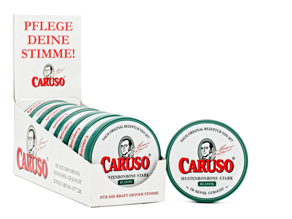 Geöffnete CARUSO Klassik Dose mit sichtbaren Hustenbonbons
